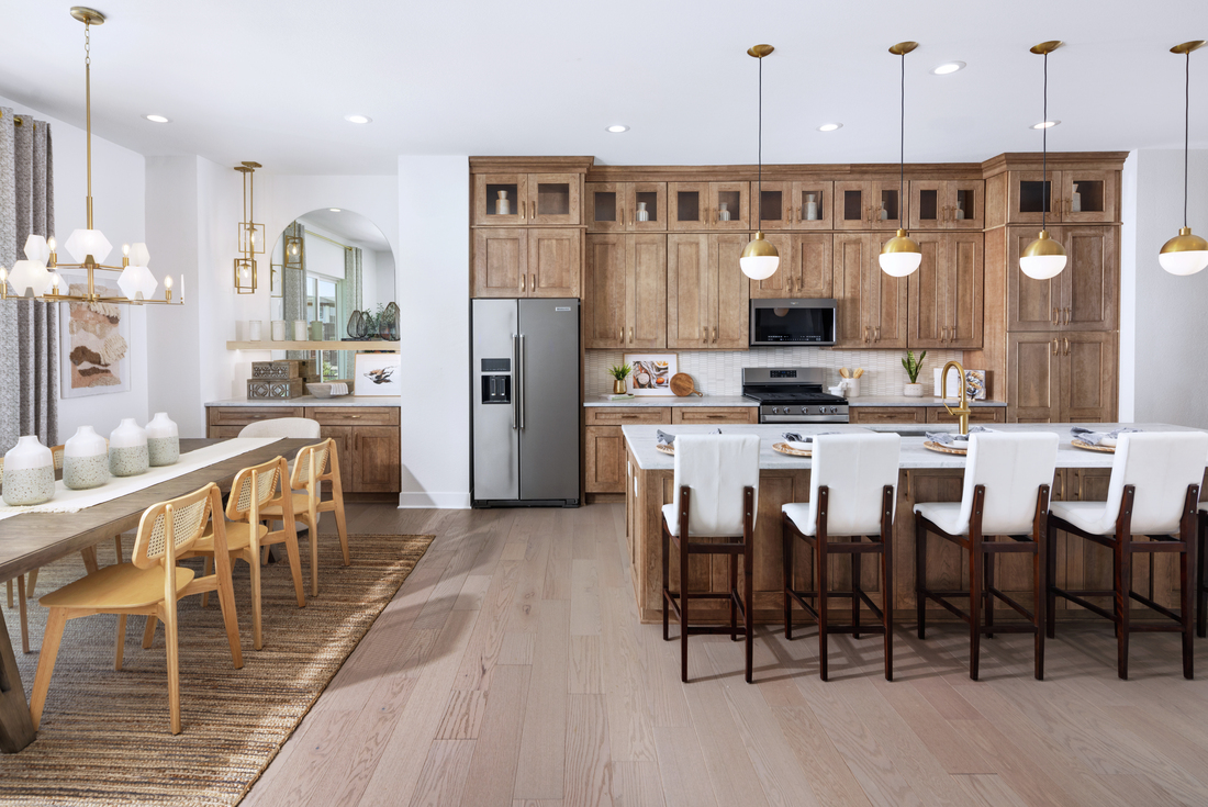 Image of kitchen and dining room of a townhome built by Toll Brothers in the Alora neighborhood in Lake Nona